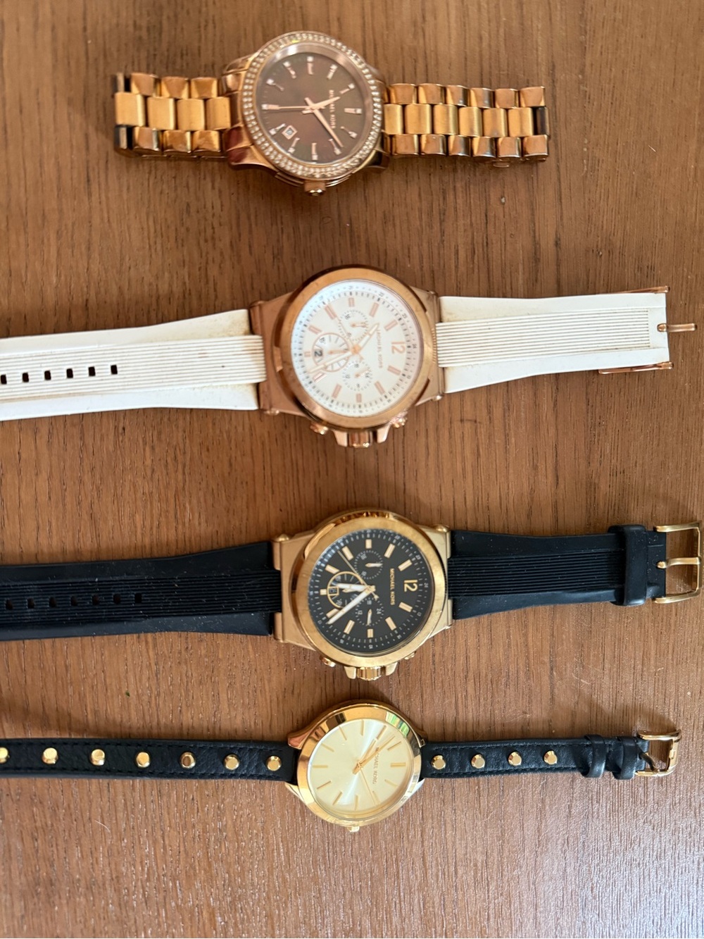 Michael Kors Rose Gold Watches with Black and White Straps and Gold Bracelet